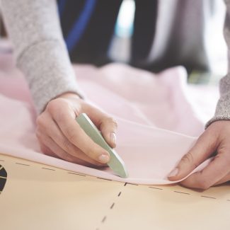 Female semastress making new patterns